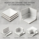 Chân tường phòng tắm hoàn thiện bằng nẹp ceramic bo cong màu trắng